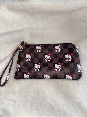 Hello Kitty Brown and White Patterned Wristlet Clutch with Red Accents